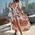 Women's Bohemian Flowy Maxi Dress - Charming V-Neck With Bell Sleeves, Bold Printed Pattern, Side Slit Design