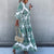 Women's Bohemian Flowy Maxi Dress - Charming V-Neck With Bell Sleeves, Bold Printed Pattern, Side Slit Design